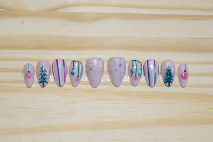 Christmas holiday press on nails with mid-century pastel theme on a wooden background