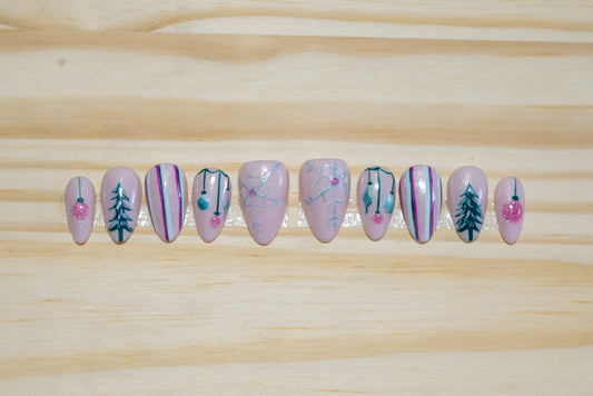 Christmas holiday press on nails with mid-century pastel theme on a wooden background